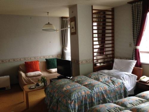 Tempat tidur dalam kamar di Kofukan - Vacation STAY 67964v