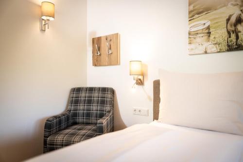 Ένα ή περισσότερα κρεβάτια σε δωμάτιο στο Wildbach Lodge Dienten