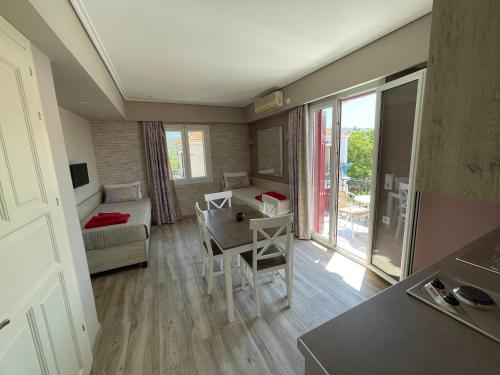 a small living room with a table and a couch at Stella Apartments in Petra
