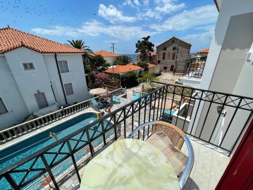 a balcony with a view of a swimming pool at Stella Apartments in Petra