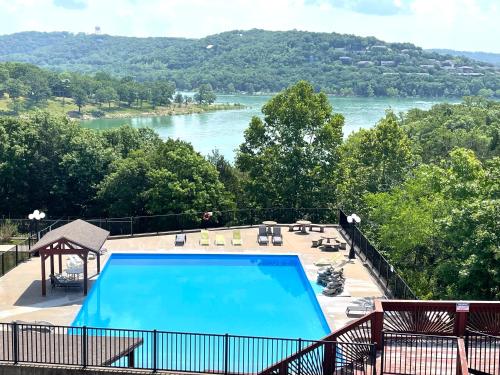 a swimming pool with a view of a river at Rockwood Condos on Table Rock Lake With Boat Slips in Branson