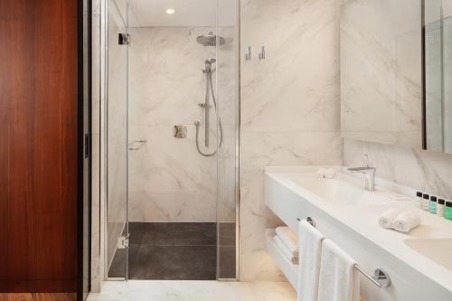 a bathroom with a shower and a sink at Four Points by Sheraton Istanbul Kagithane in Istanbul