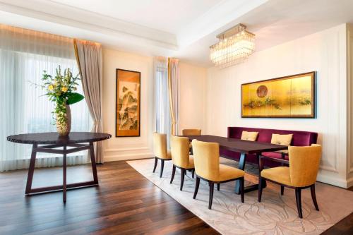 a dining room with a table and chairs at The St. Regis Osaka in Osaka