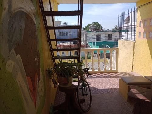 a bike parked on the side of a building at AH KIN Cancun Centro in Cancún