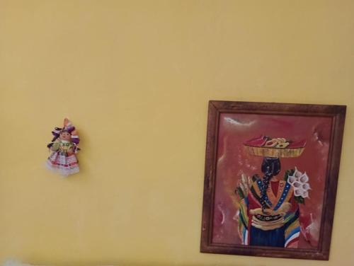 a picture of a woman on a wall at AH KIN Cancun Centro in Cancún