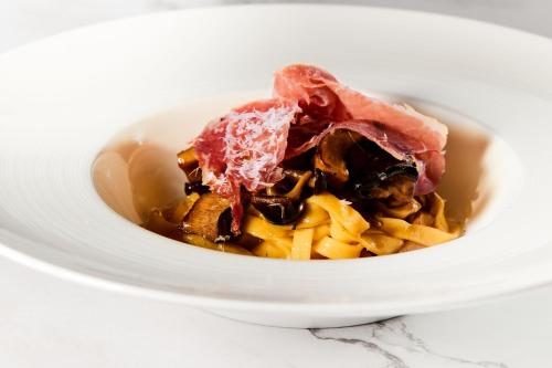 a bowl of food with meat and cheese at The St. Regis Osaka in Osaka