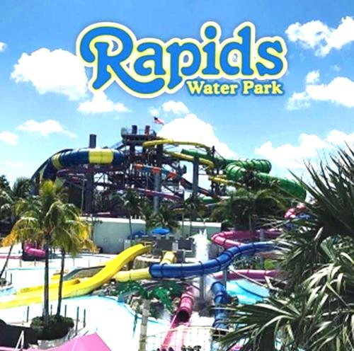 a water park at a resort with a roller coaster at Wellington Garden in West Palm Beach