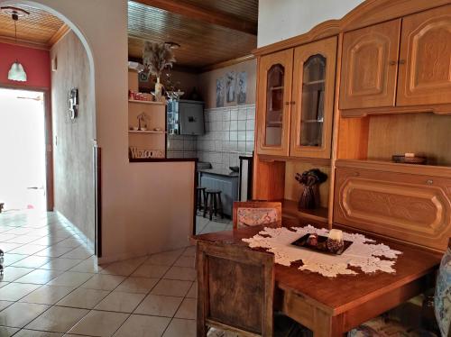 a kitchen with a wooden table in a room at Angelic House in Spetses