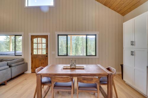 a dining room with a wooden table and chairs at Lakeside Cabin with Hot Tub 3 Mi to Flathead Lake! in Lakeside