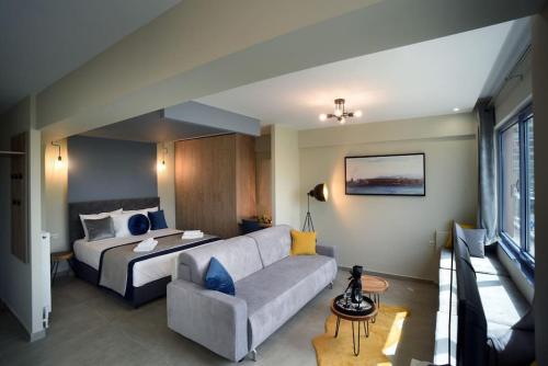 a living room with a bed and a couch at Porto Boutique #B in Thessaloniki
