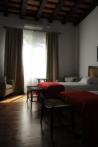 Postel nebo postele na pokoji v ubytování Hotel Hostal del Espinillo