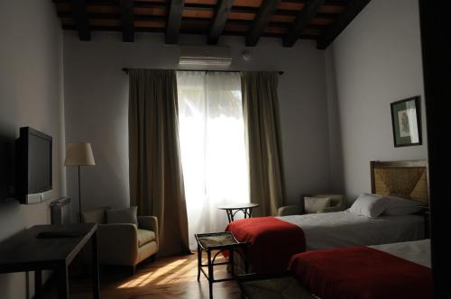 Postel nebo postele na pokoji v ubytování Hotel Hostal del Espinillo