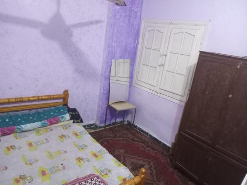 Postel nebo postele na pokoji v ubytování الاسكندرية العجمي الهانوفيل