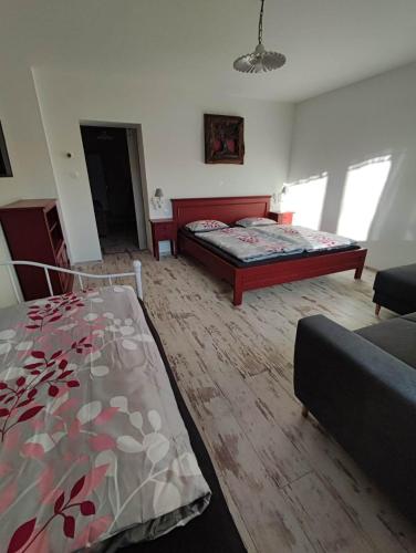 a living room with two beds and a couch at Apartmán Šumiac 6 in Šumiac