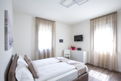 Ένα ή περισσότερα κρεβάτια σε δωμάτιο στο BORGO VERTICALE Luxury Apartments