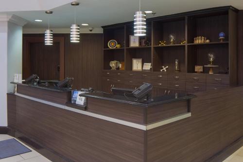 a lobby with a checkout counter in a store at Four Points by Sheraton Orlando International Drive in Orlando