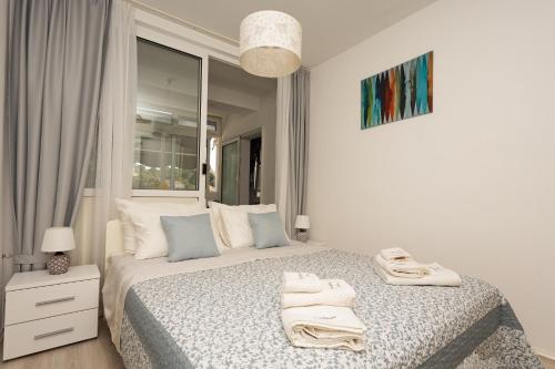 Postel nebo postele na pokoji v ubytování Apartman Nina