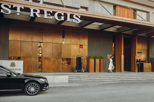 a black car parked in front of a store at The St. Regis Istanbul in Istanbul