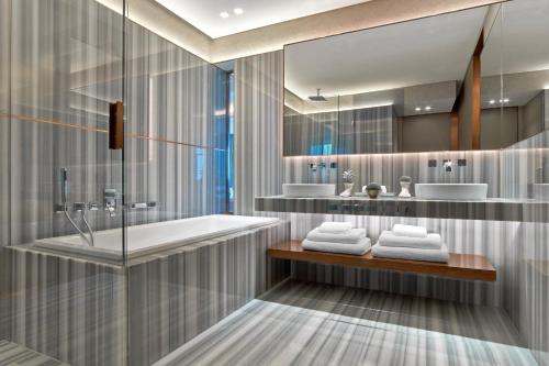 a bathroom with a tub and a sink at The St. Regis Istanbul in Istanbul