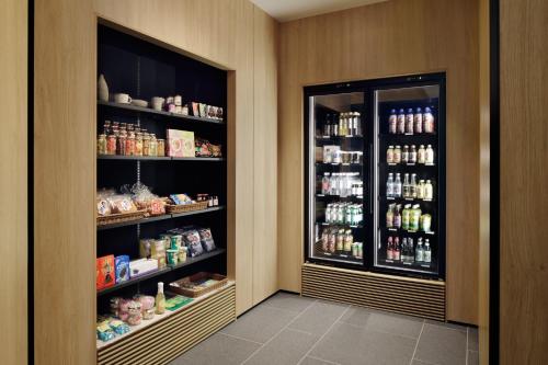 a store room with two refrigerators with food and drinks at Fairfield by Marriott Gifu Gujo in Gujo