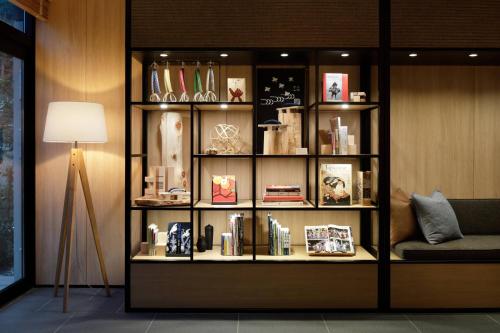 a book shelf filled with books and a lamp at Fairfield by Marriott Gifu Gujo in Gujo
