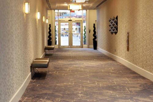 a hallway of a building with chairs and a door at Philadelphia Airport Marriott in Philadelphia