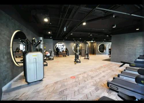 a gym with a machine in the middle of a room at Simpaş Queen residence 2 bedroom in Istanbul