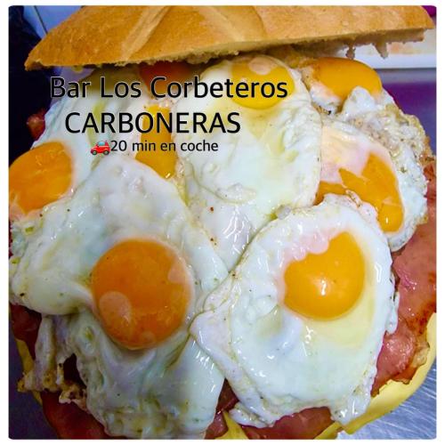 two fried eggs on top of a sandwich at Cabaña de madera especial y acogedora in Cardenete