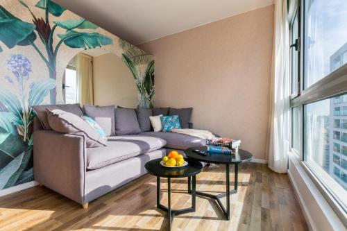 a living room with a couch and a table at Trendy Apartment in Puerto Madero in Buenos Aires