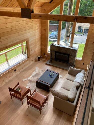 an overhead view of a living room with a fireplace at WoodHunterHome in Platte Clove