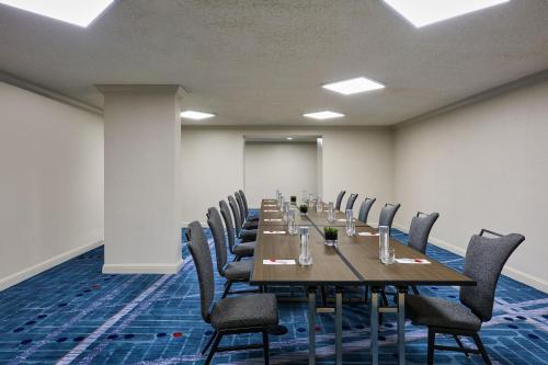 a conference room with a long table and chairs at Los Angeles Airport Marriott in Los Angeles