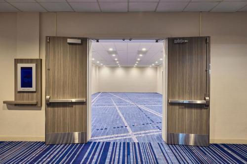 an open door in a room with a hallway at Los Angeles Airport Marriott in Los Angeles