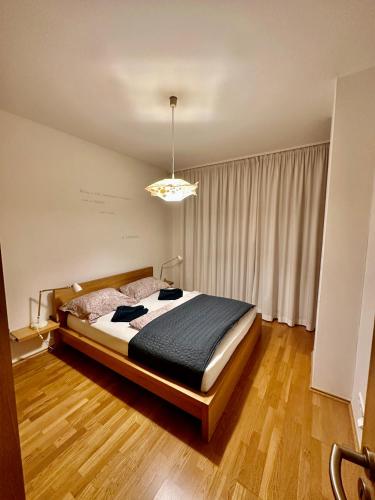 a bedroom with a large bed in a room at Central apartment with balcony in Budapest