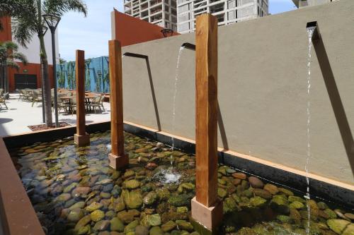 a water feature in a building with a fountain at Culiacan Marriott Hotel in Culiacán