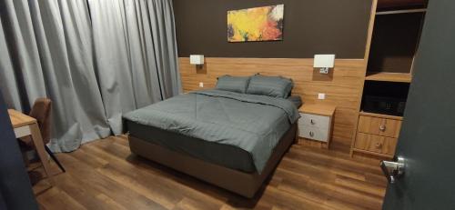 Postel nebo postele na pokoji v ubytování H&W Sunway Onsen Suites Services Tambun Ipoh S-07-05