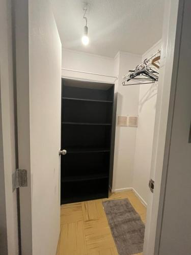a hallway with a black door in a room at Departamento equipado 348 Ovalle in Ovalle