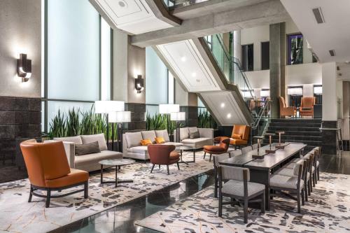 a lobby of a hotel with couches and chairs at Delta Hotels by Marriott Vancouver Downtown Suites in Vancouver