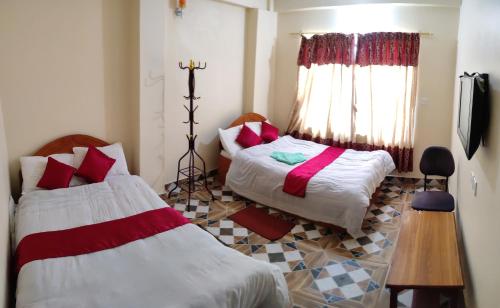 Sarangkot Hotel New Galaxyにあるベッド