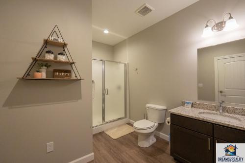 a bathroom with a toilet and a shower and a sink at Luxury 3BR Condo - Stairs Required - Resort Amenities - FREE TICKETS INCLUDED - FHG-308 in Branson