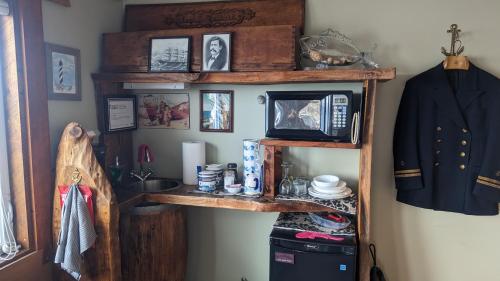 a room with a wooden shelf with a sink at SeaWatch Bed & Breakfast in Halifax