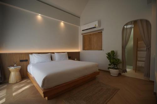 Ένα ή περισσότερα κρεβάτια σε δωμάτιο στο River Kwai Kiri Resort