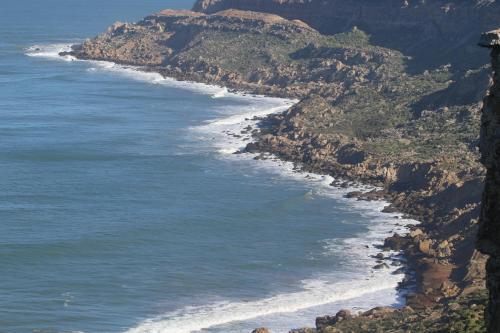 an aerial view of the ocean and mountains at Ait Mouli Surf House in Safi