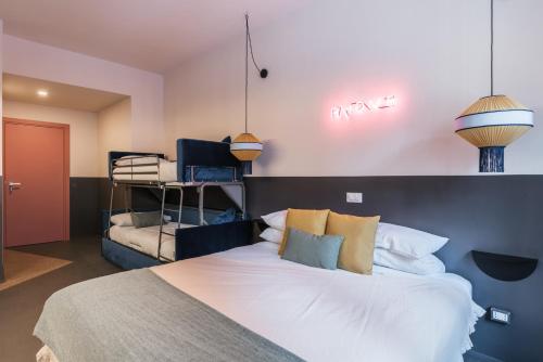 a bedroom with a large white bed with pillows at MARCANTONIO HOME ROME - Vatican - in Rome