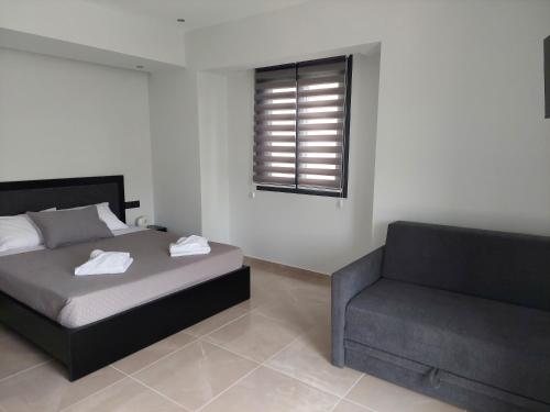 Letto o letti in una camera di Luana Monte Apartments