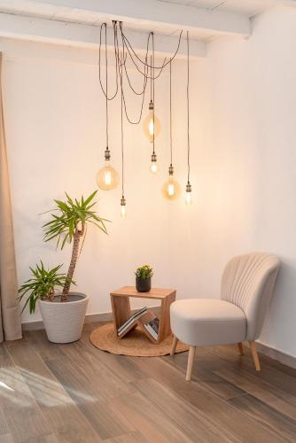 a living room with a chair and a table at Porto di Clanezzo in Clanezzo