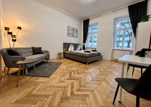 a living room with a couch and a table at little cozy residence - enjoy Viennas summer season in Vienna