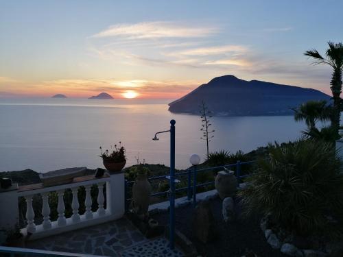 a view of the ocean with a sunset in the background at Villa Panorama in Lipari