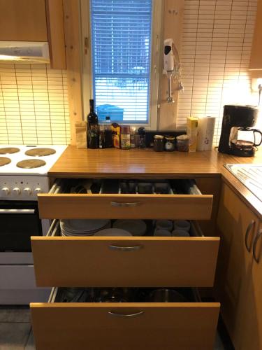 a kitchen with a counter with drawers in it at Holiday Home Amero purnu 4 in Kolinkylä
