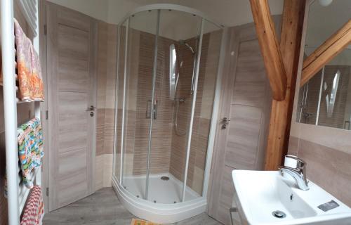a bathroom with a shower and a sink at Holiday Home Benecko 101 in Benecko