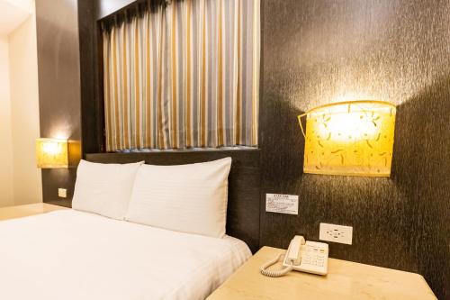 Postel nebo postele na pokoji v ubytování I HI Sanduo Travel Hotel